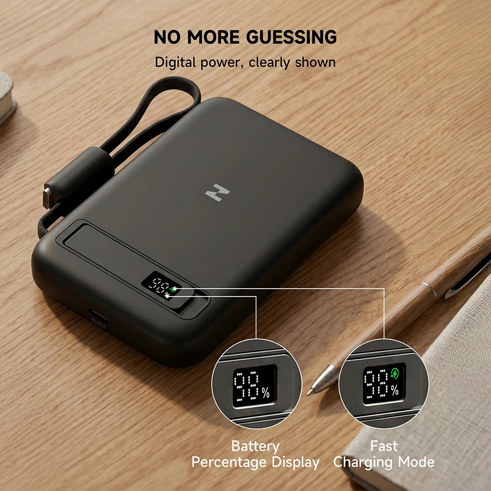 Black MagAir semi-solid-state magnetic power bank with a digital display on a wooden surface. #color_black