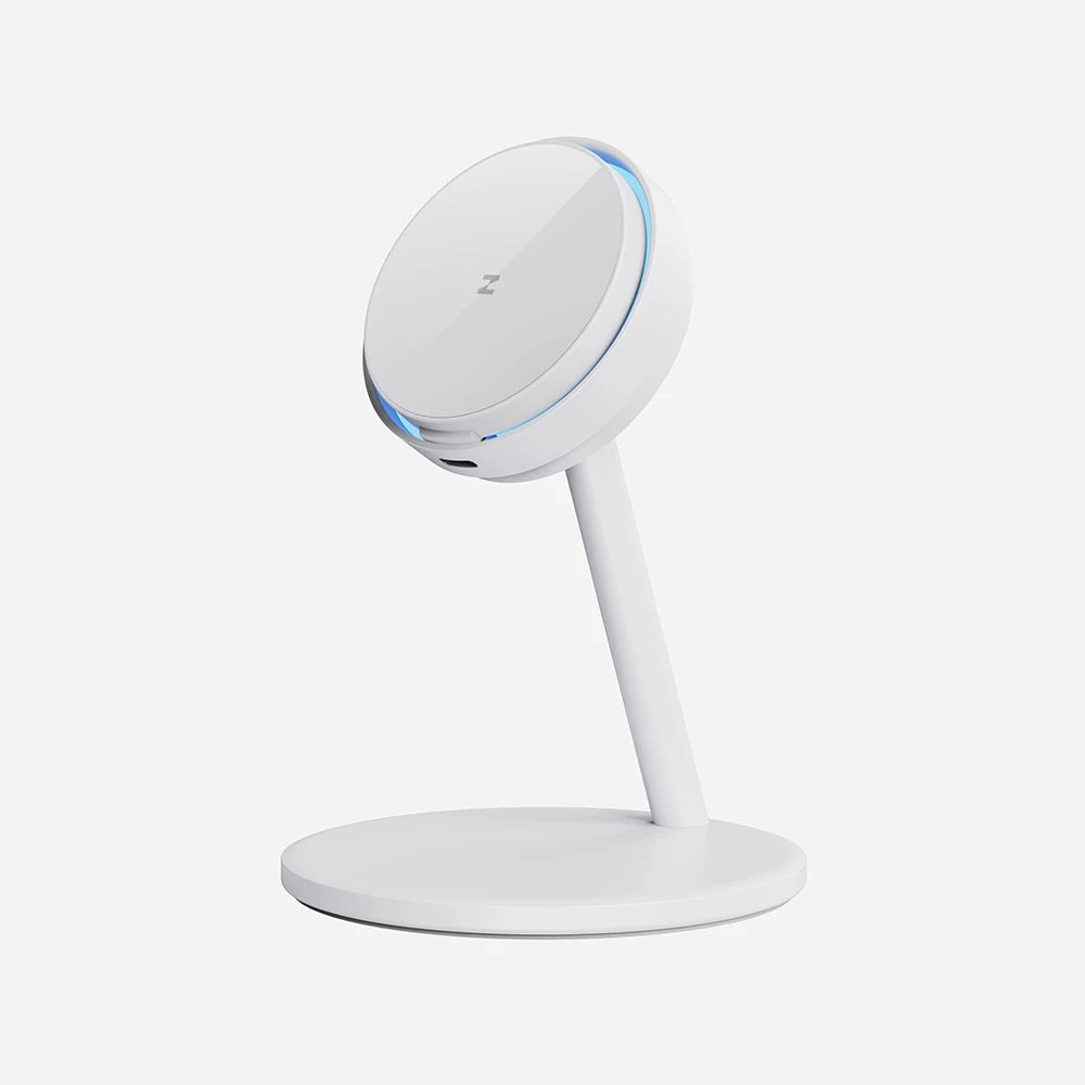 CoreDock white wireless charging stand with a circular charging pad, matching round base, and subtle blue LED ring around the charging surface on a light gray background. #color_white