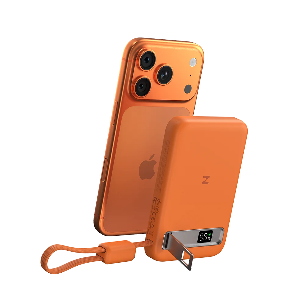 MagAir magnetic wireless power bank attached to an orange iPhone on a white background