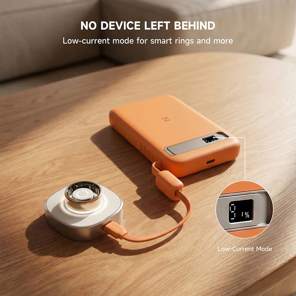 MagAir orange magnetic power bank with charging cable on a wooden surface, featuring low-current mode for smart rings and other small devices. #color_orange