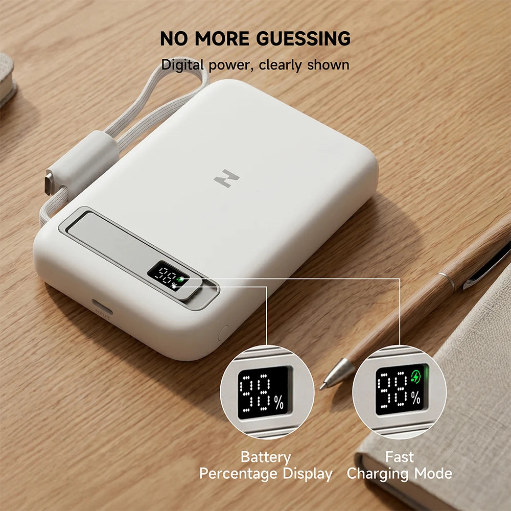 MagAir white magnetic power bank with digital battery display on a wooden surface. #color_white