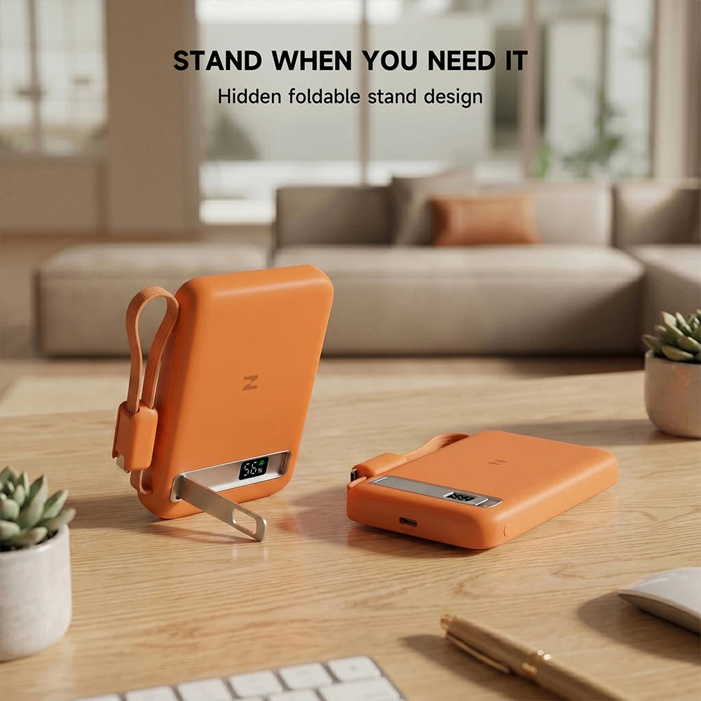 Orange MagAir semi-solid-state power bank with its built-in stand propping up a smartphone on a table, featuring the slogan “Your View, Your Way.” #color_orange