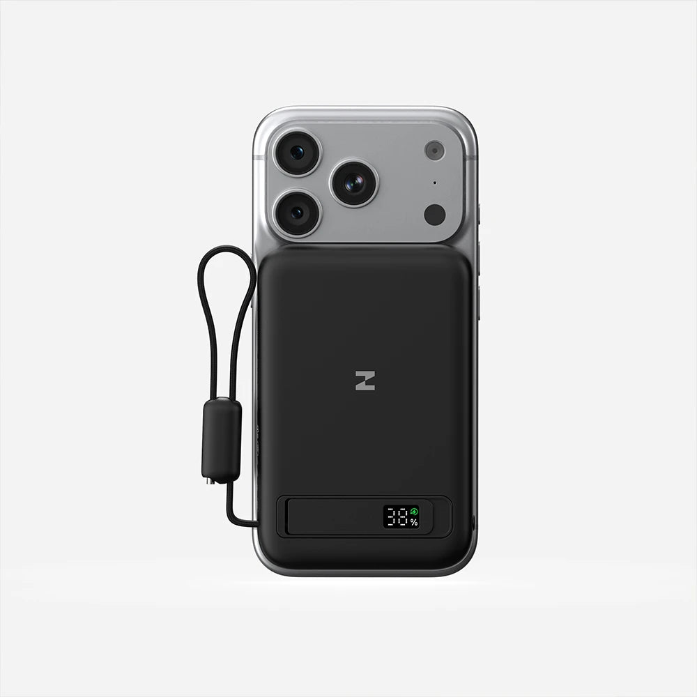 Smartphone with a black MagAir magnetic power bank attached, showcasing the magnetic connection on a white background. #color_black