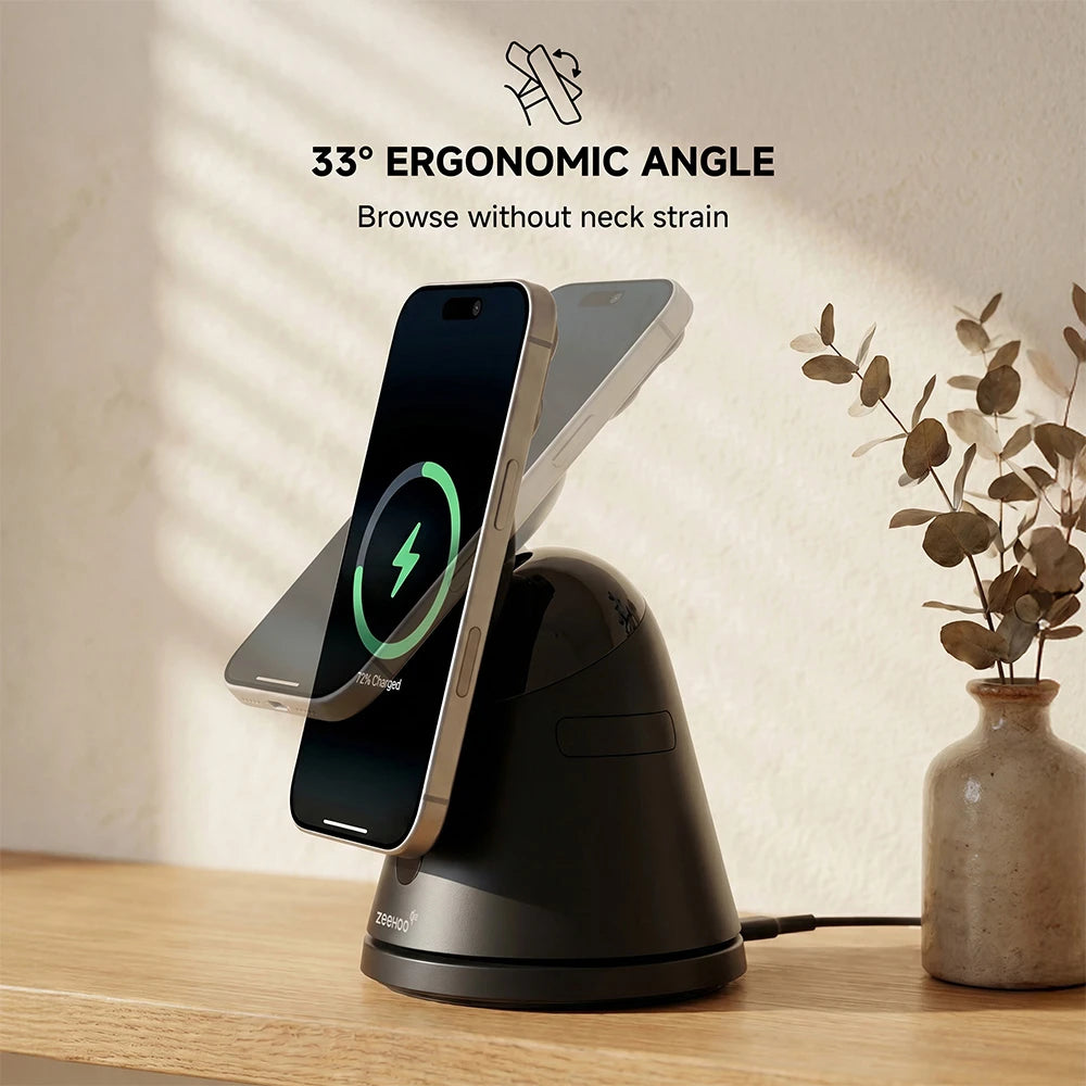 Phone charging stand with ergonomic design on a wooden surface with a vase and plant. #color_black