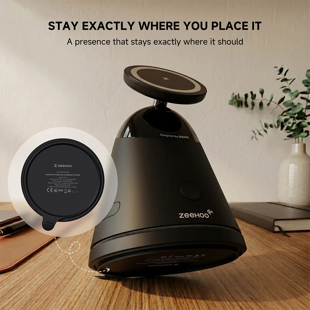 ZEEHOO LuminoCore black 4-in-1 wireless charging station with ZEEHOO branding displayed on a wooden surface in a modern interior setting. #color_black