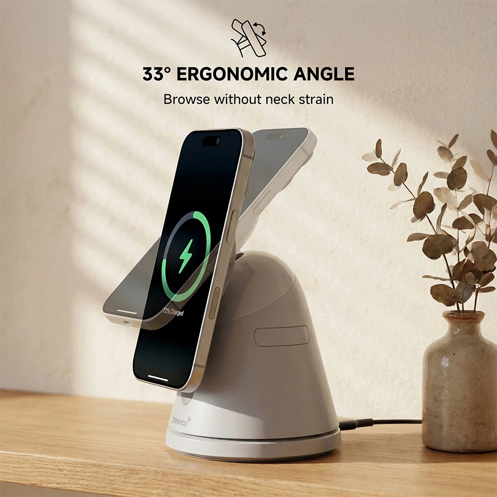 ZEEHOO LuminoCore gray 4-in-1 wireless charging stand holding a smartphone on a wooden desk, featuring a vase with plants in a clean modern interior. #color_gray