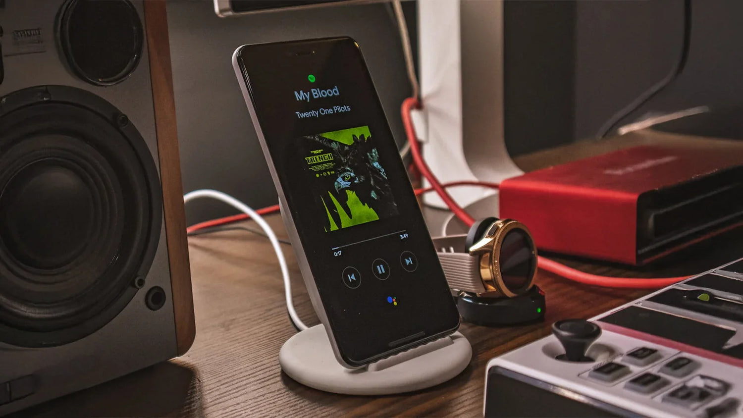 charging smartphone beside smartwatch