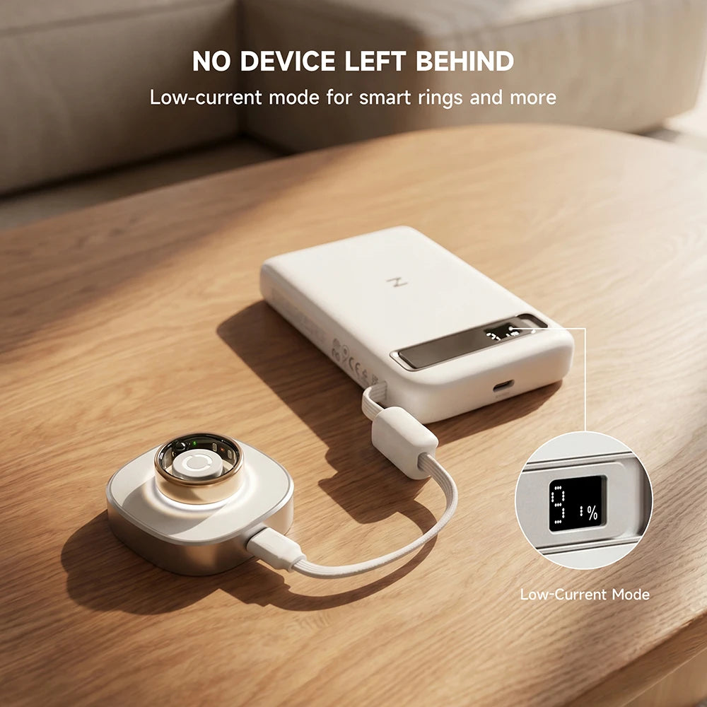 MagAir white magnetic power bank with charging cable on a wooden surface, featuring low-current mode for smart rings and other small devices. #color_white