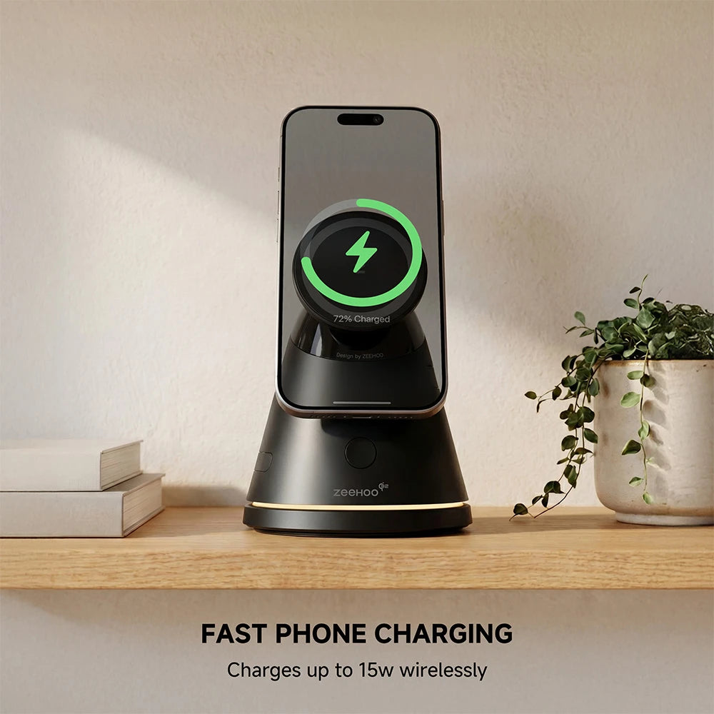 ZEEHOO LuminoCore black 4-in-1 wireless charging stand with smartphone on a wooden surface, styled with books and a plant in a modern interior setting. #color_black