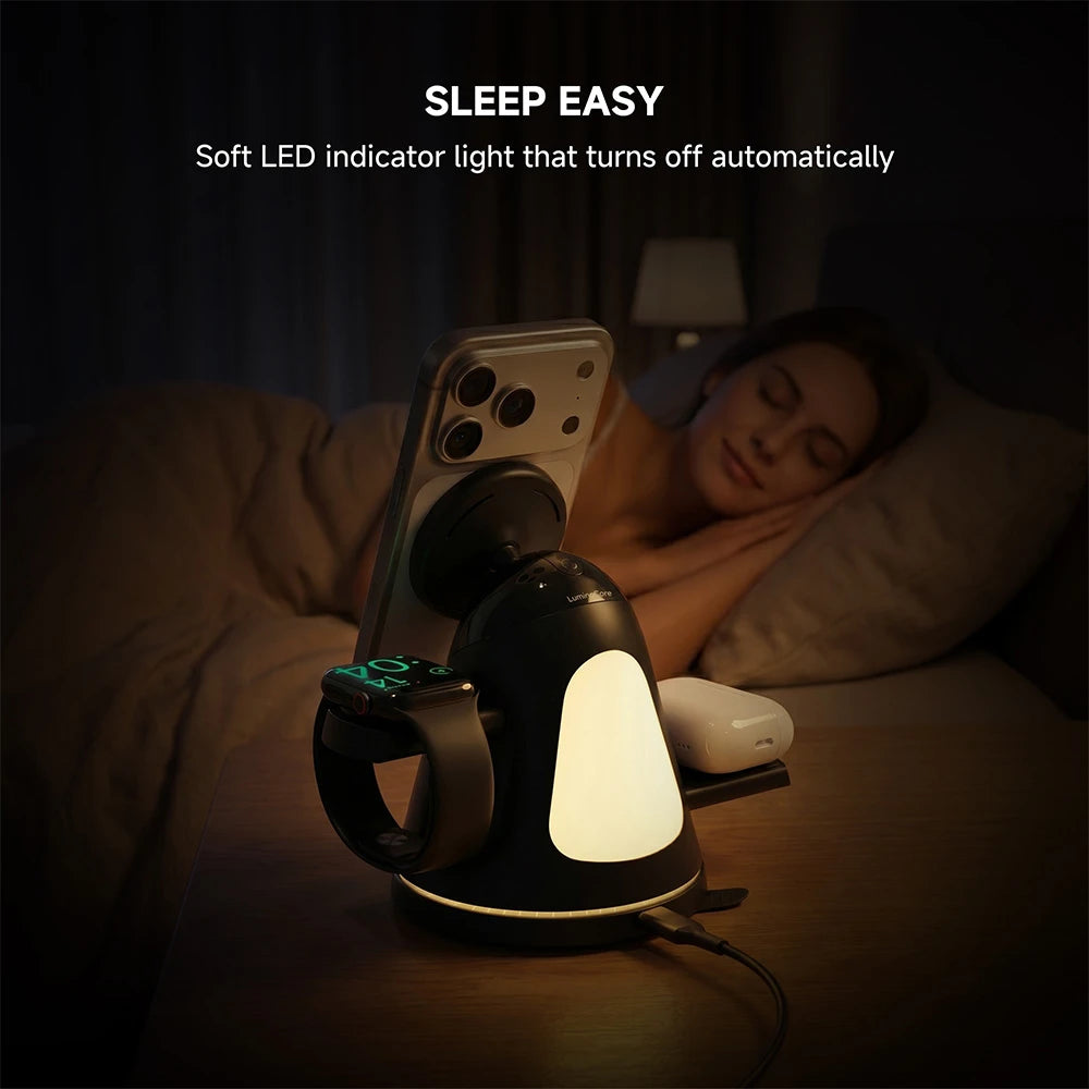 ZEEHOO LuminoCore black 4-in-1 wireless charging station on a bedside table with smartphone and soft LED night light, designed for a comfortable sleep environment. #color_black