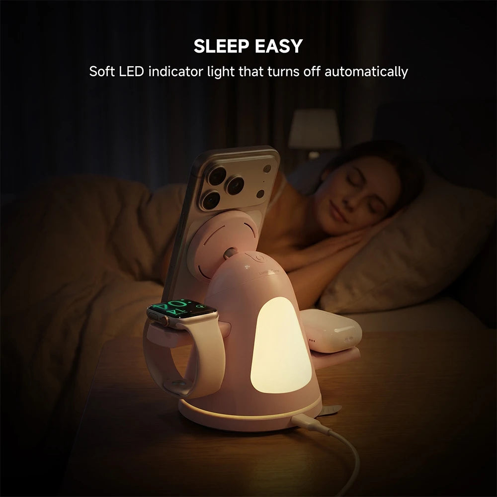 ZEEHOO LuminoCore pink 4-in-1 wireless charging station on a bedside table charging a smartphone, featuring soft LED indicator light for sleep-friendly nighttime use. #color_pink