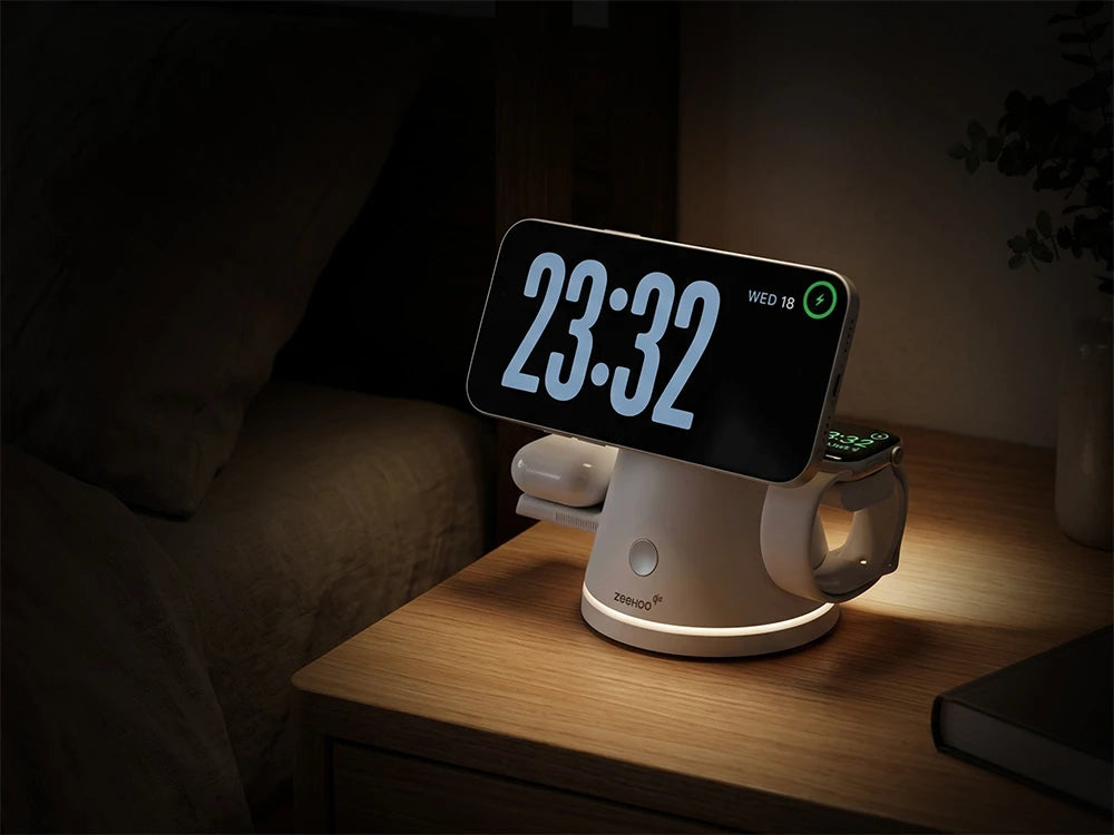 ZEEHOO LuminoCore wireless charging stand on a wooden surface in a dimly lit room, with its built-in night light softly illuminating the corner, quietly powering essential devices.